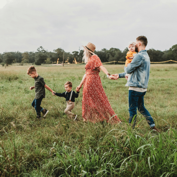 Family walking in an open field in Bethel Park, PA